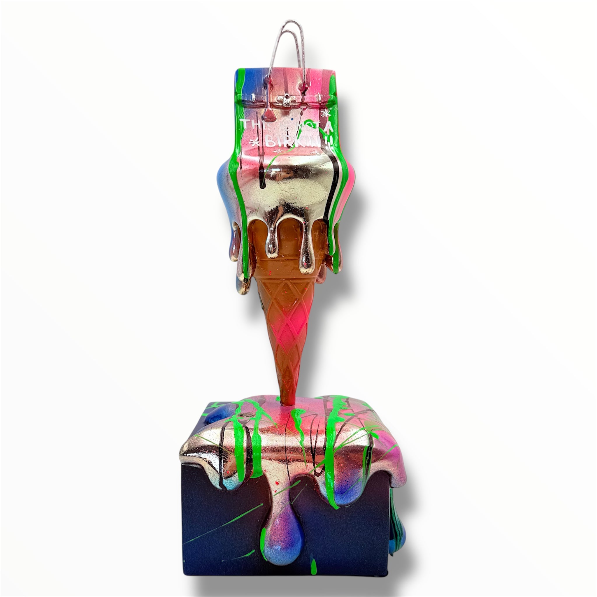 Colorful ice cream cone ornament with drips on a white background