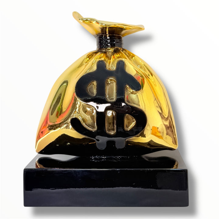 luxury gold money bag sculpture with dollar symbol on black base