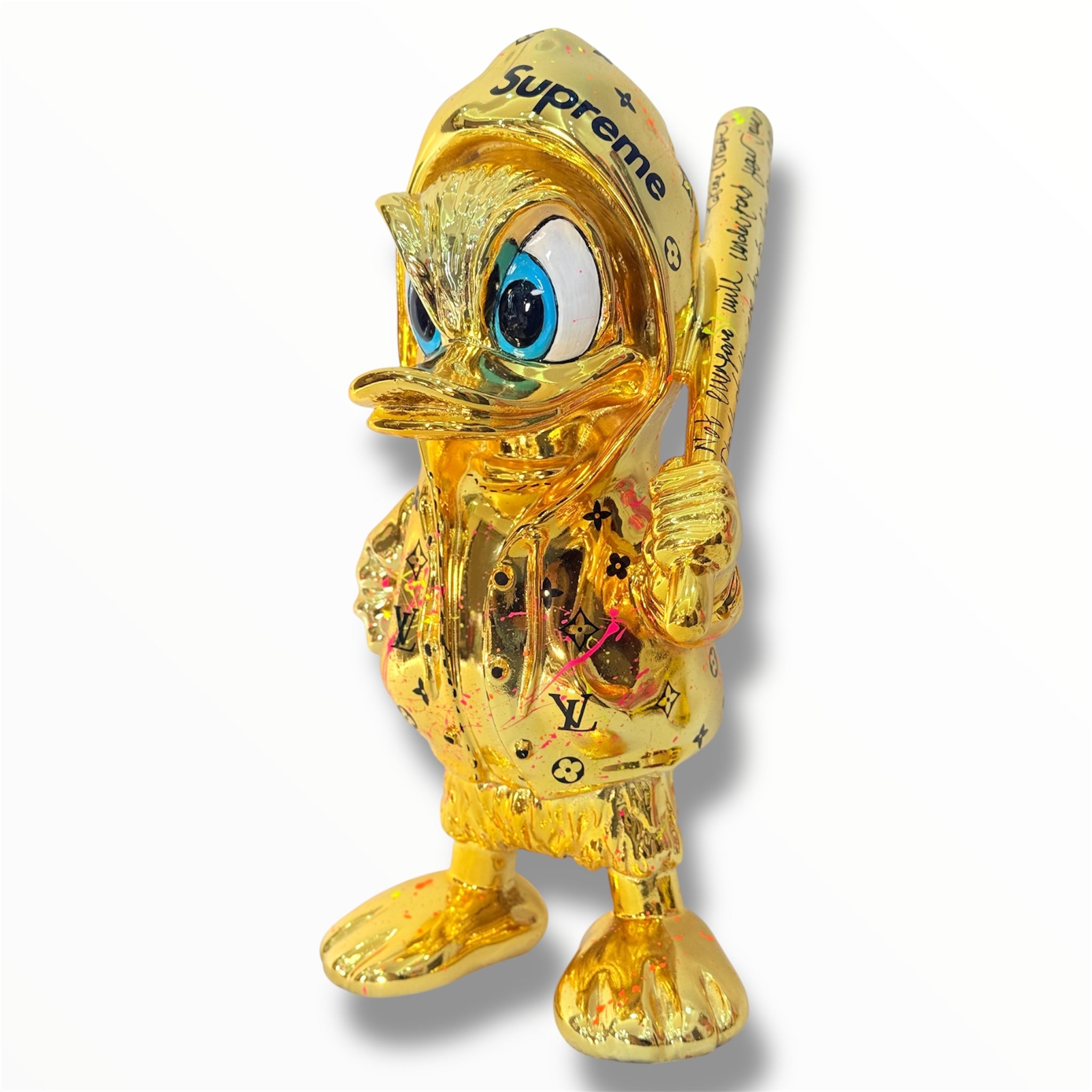 gold chrome duck sculpture with supreme and lv graffiti design