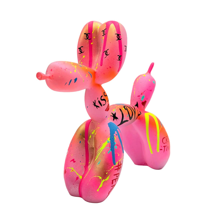 Colorful balloon dog sculpture with text on a white background